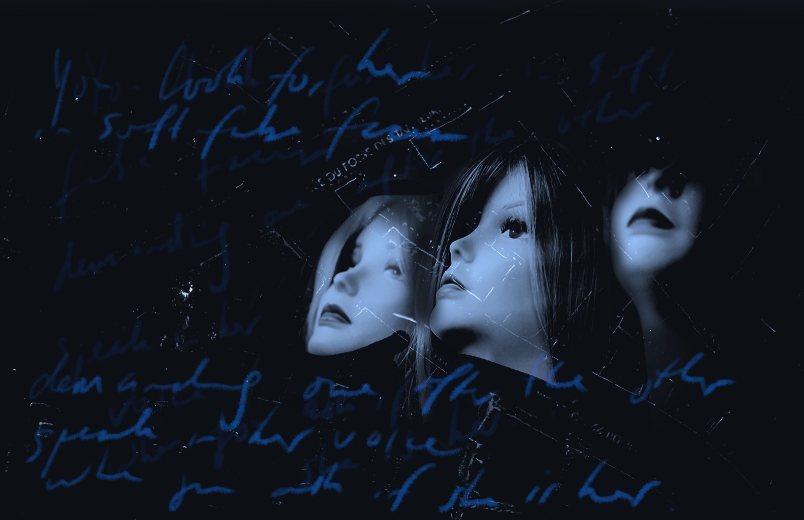 Three mannequin heads in a shop window, handwriting across the image